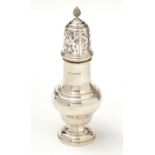 A George V silver sugar caster.