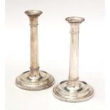 A pair of Elizabeth II silver candlesticks.