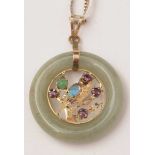 A jade coloured stone and gemstone pendant