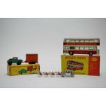 A selection of Dublo Dinky Toys and other toys.