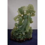 A Chinese carved jade figure