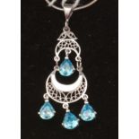 A blue stone set drop pendant and chain.