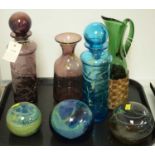 Selection of coloured glassware including Mdina.