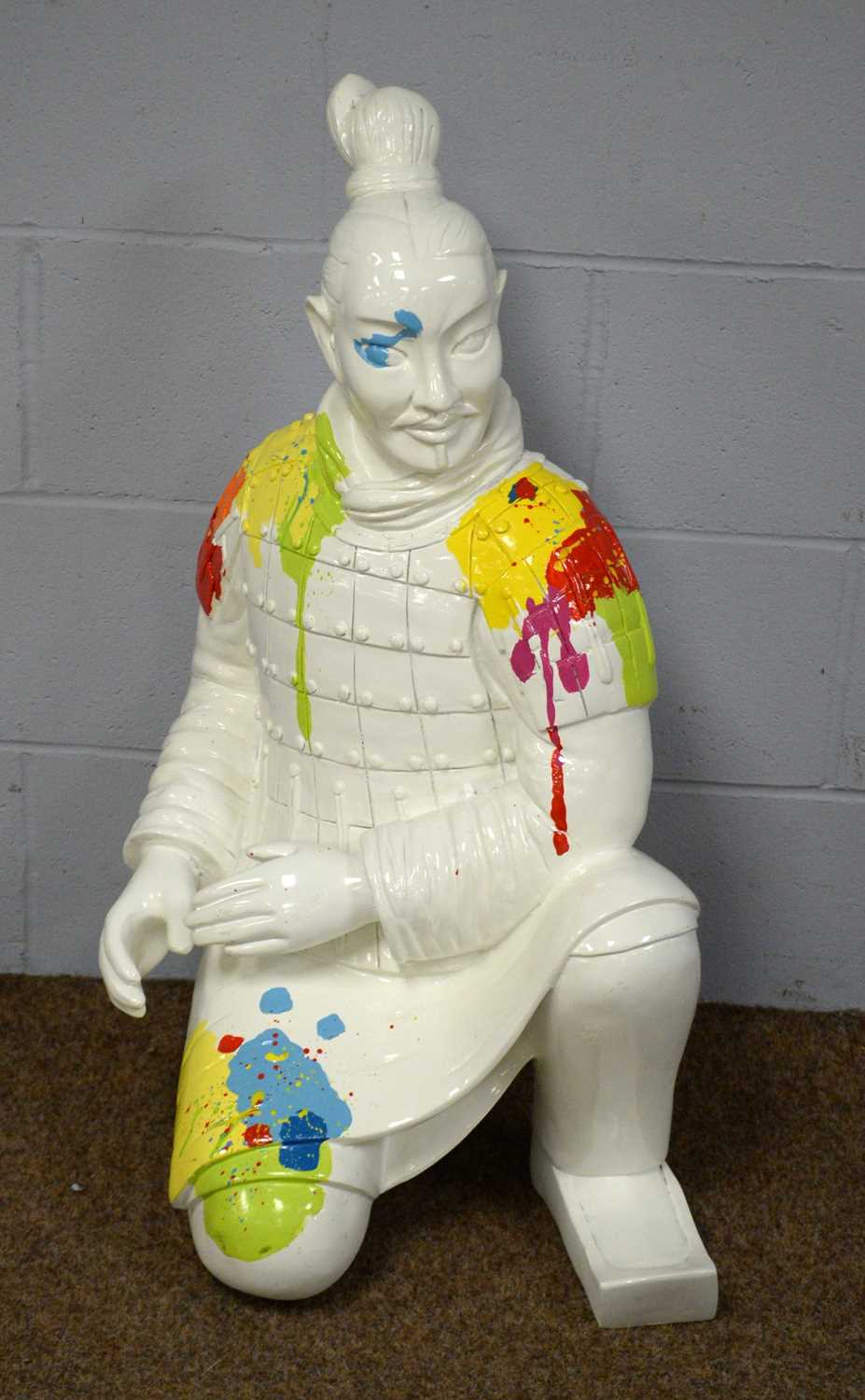 Contemporary figure of a kneeling Samurai.