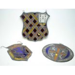 A selection of three armorial plaques.