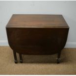 Early 20th C mahogany drop leaf dining table.