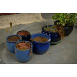 A selection of blue garden planters