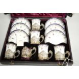 Royal Worcester part coffee set with silver cup receivers.