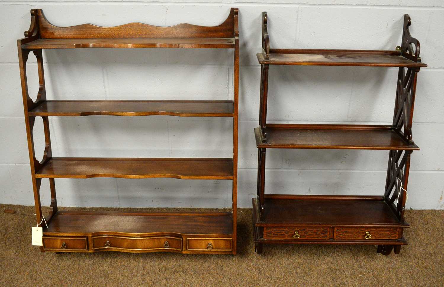 Two 20th C mahogany hanging shelves.