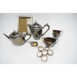 A four-piece electroplate tea service and a silver photograph frame