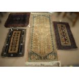 A South East Persian rug and three other rugs