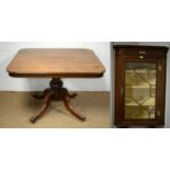 A Georgian style mahogany corner cupboard and a Victorian mahogany breakfast table