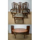 Early 20th C walnut extending dining table, six Georgian style dining chairs