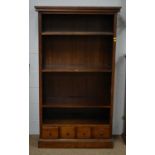 A modern stained oak bookcase unit