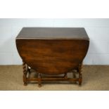 1920's stained oak drop leaf dining table.