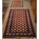 A Caucasian mat and a Bokhara rug