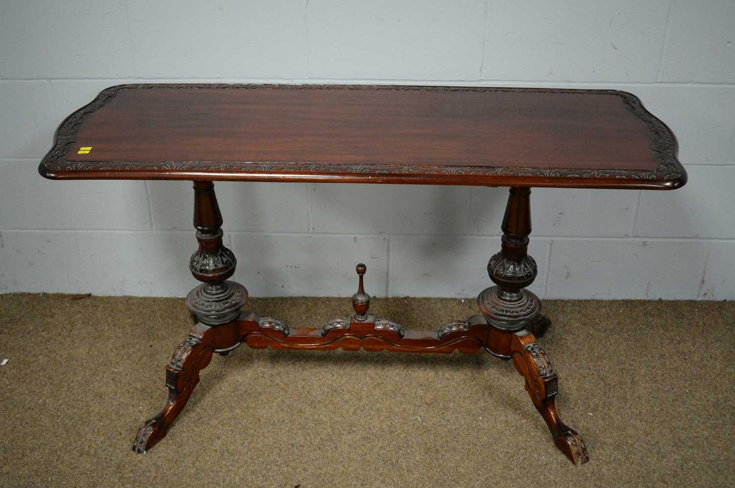 A Victorian-style mahogany centre table
