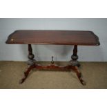 A Victorian-style mahogany centre table