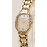 A lady's 9ct gold Tissot wristwatch with diamond-set bezel