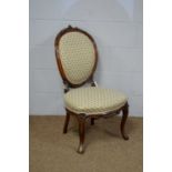 A decorative Victorian carved walnut salon chair