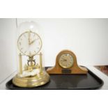 Edwardian inlaid oak mantel clock and a Bentima anniversary clock