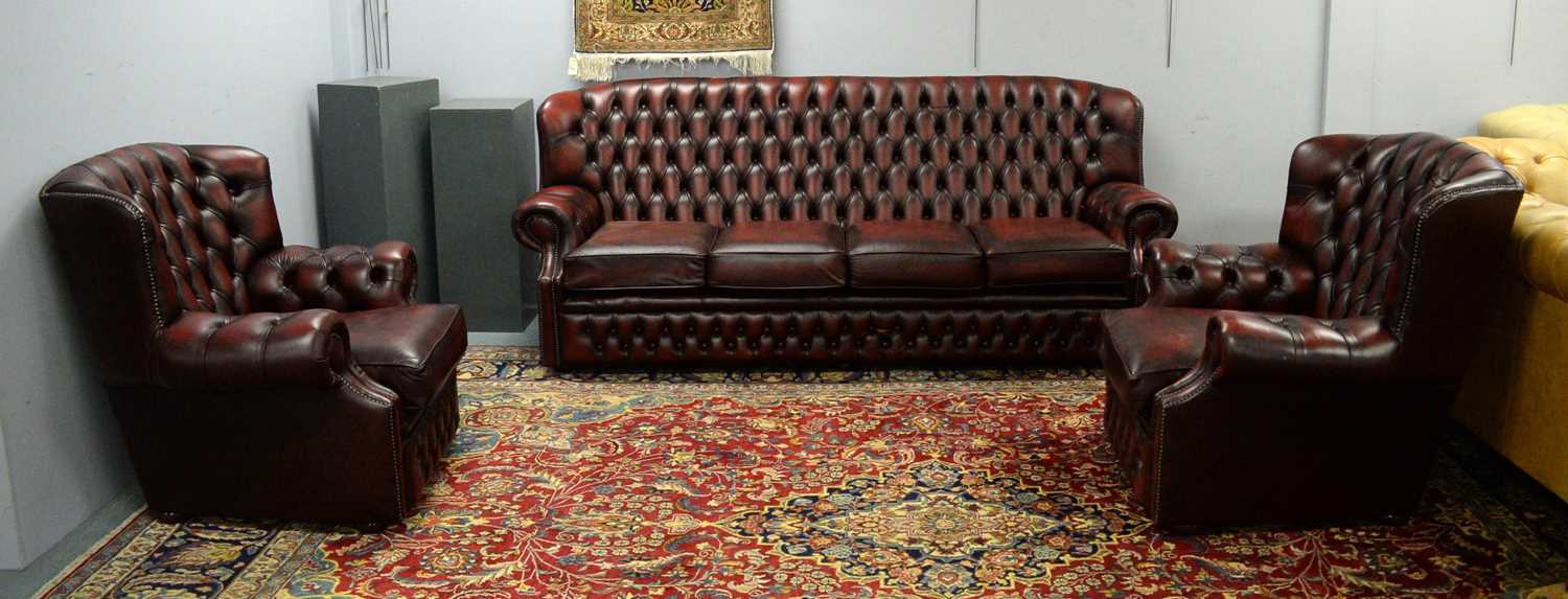 A Chesterfield style oxblood three-piece suite,