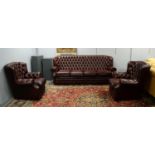 A Chesterfield style oxblood three-piece suite,