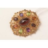 A 9ct gold and gemstone set brooch