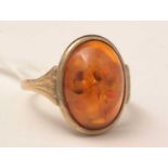 A 9ct gold and Baltic amber ring