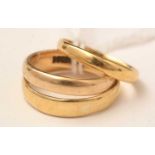 Three gold wedding bands