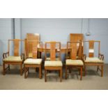 An Asian hardwood extending D-end dining table; and eight chairs