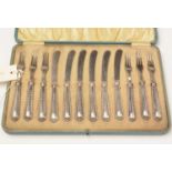 A George V cased set of six silver pasty knives and forks