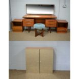 A dressing table with stool and two bedside cabinets