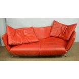 De Sede: a red leather settee.