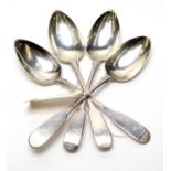 A matched set of four Georgian Newcastle silver tablespoons