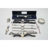 Elizabeth II silver hinged bangle; and a collection of dress watches.