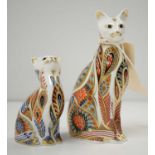 Two Royal Crown Derby cat paperweights.