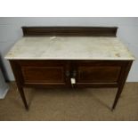 An Edwardian mahogany washstand.