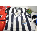 Two Newcastle United FC shirts.