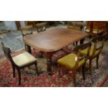 A Victorian extending dining table; and two sets of three dining chairs. (7)