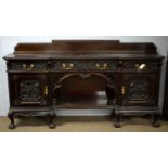 A late Victorian inverted breakfront sideboard.