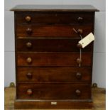 An early 20th C miniature chest of six drawers.