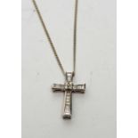 A diamond cruciform pendant necklace