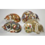 Collection of four Royal Crown Derby cat paperweights.