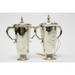 A pair of George V silver trophy cups