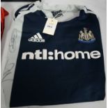 Newcastle United F.C. training shirts; another; and a T-shirt.