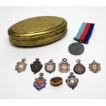 Silver fob medals, a First World War medal, and a tobacco tin