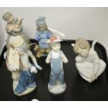 Three Lladro figures; and two Nao figures.