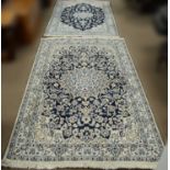 Tow modern Persian Tabriz-style rugs.