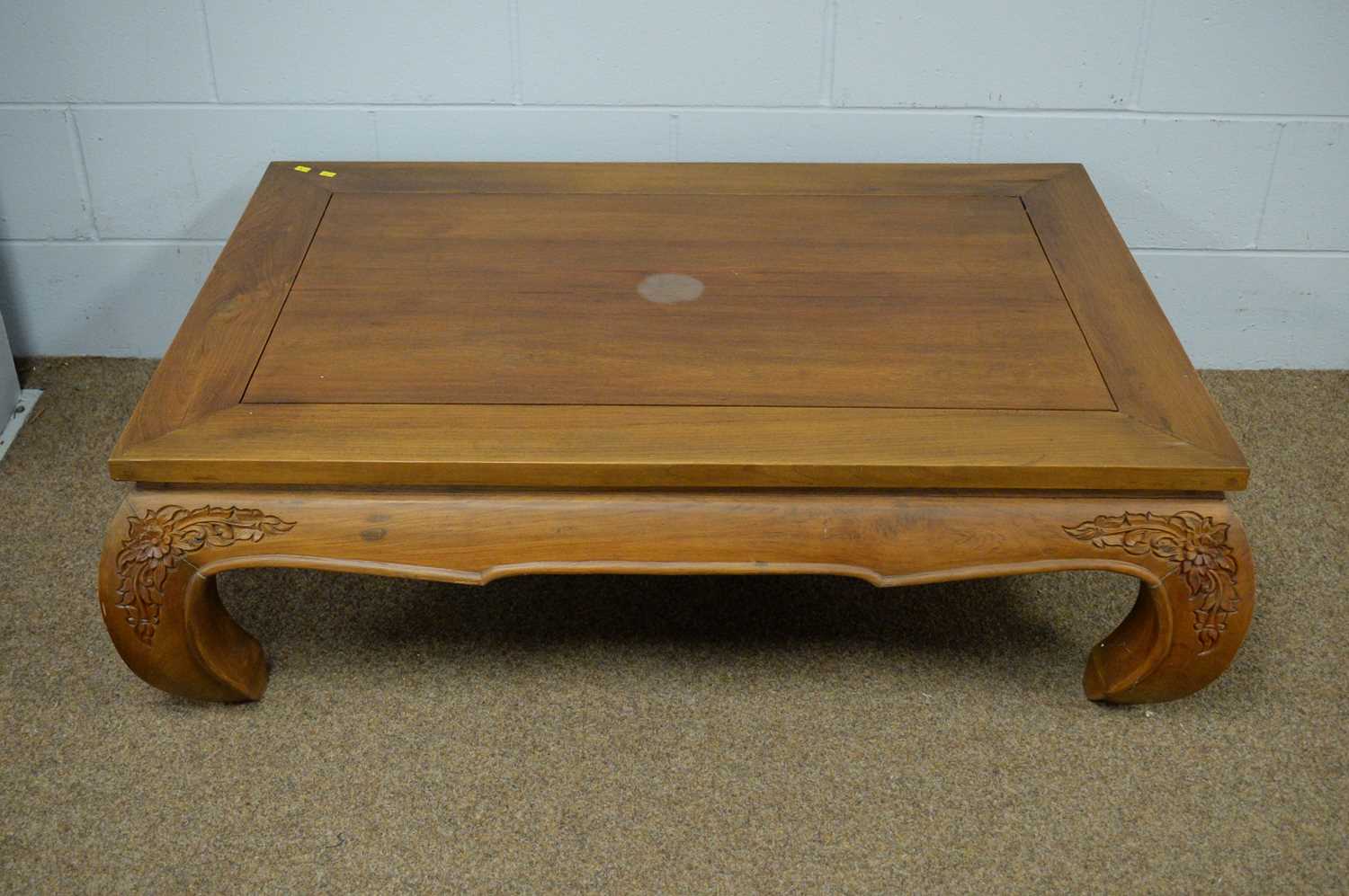 A Chinese hardwood coffee table.